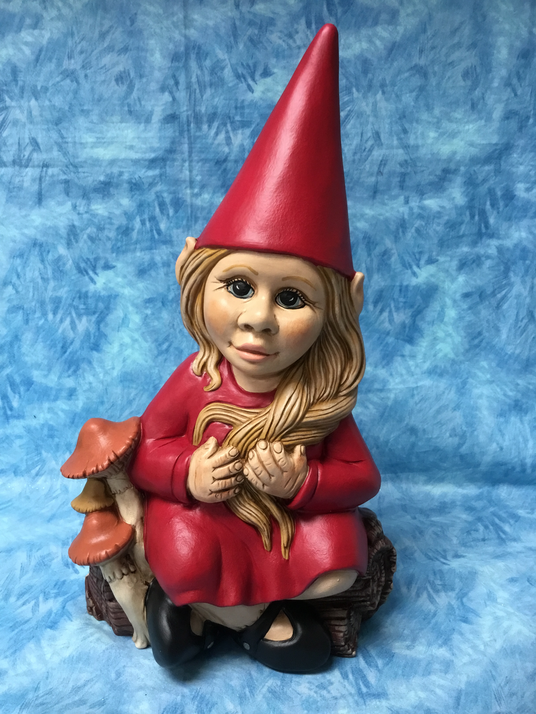 Friendly Girl Gnome Sitting with Mushrooms